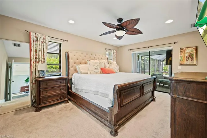Bedroom featuring ceiling fan, light colored carpet, access to exterior, and recessed lighting