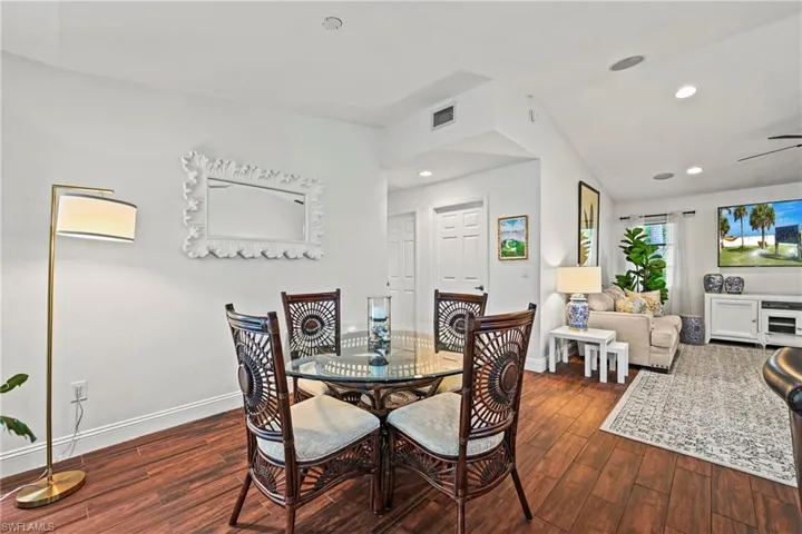 Dining space featuring recessed lighting, dark wood-type flooring, and ceiling fan
