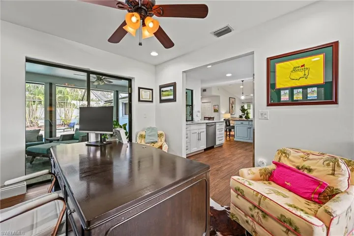 Office area with dark wood finished floors, recessed lighting, and a ceiling fan