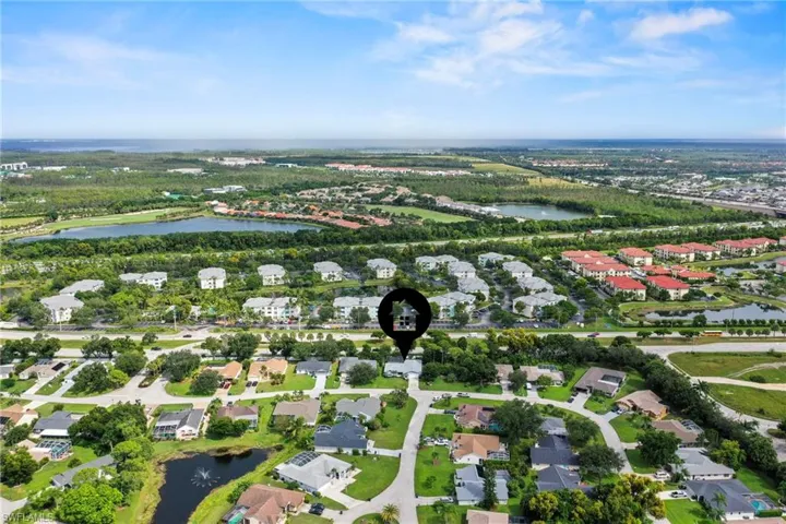 Aerial view of property's location with nearby suburban area