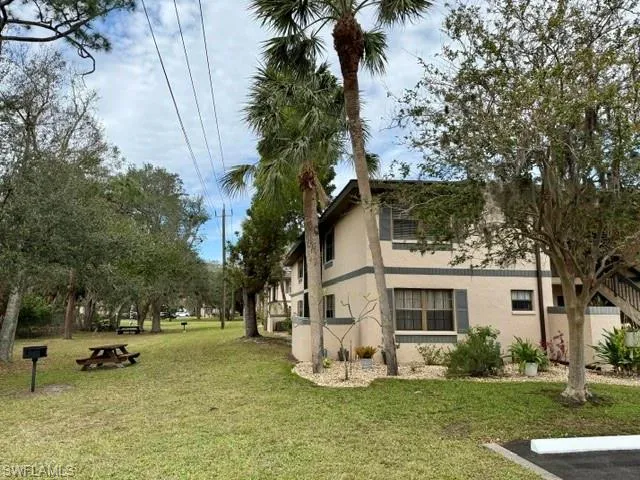 View of home's exterior with a yard