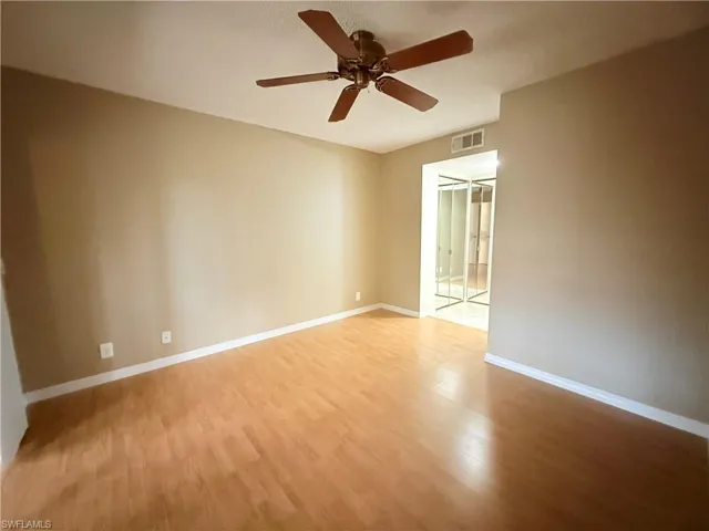 Empty room featuring ceiling fan and light wood-type flooring