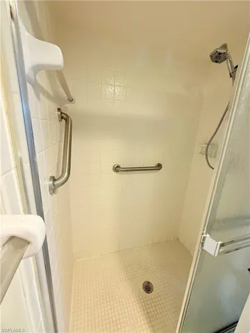 Bathroom featuring a shower with shower door