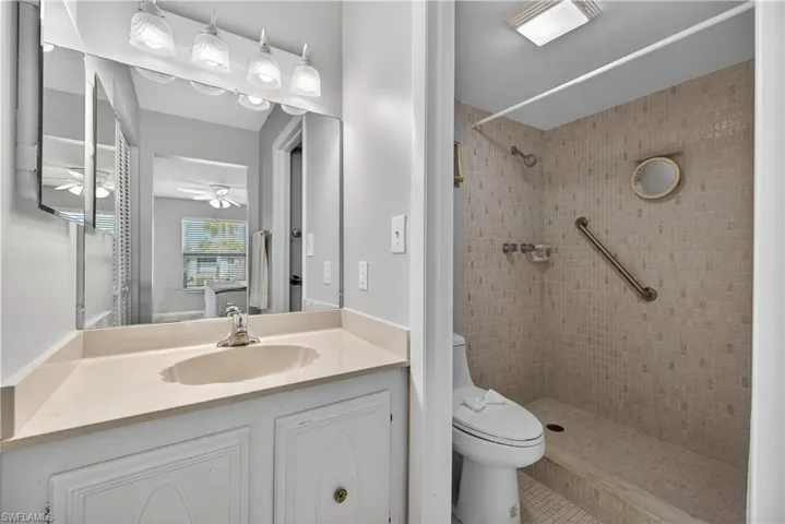 Primary ensuite bathroom with a tiled walk-in shower.