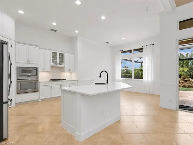 Beautiful white kitchen with natural glass range