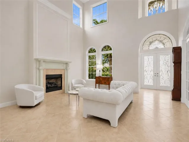 Soaring ceilings, tile floors, Electric window shades.