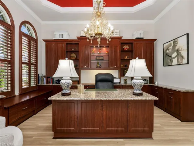 First floor office with built-in cabinets and office desk