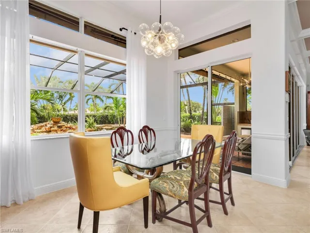 Spacious eating area overlooking the pool