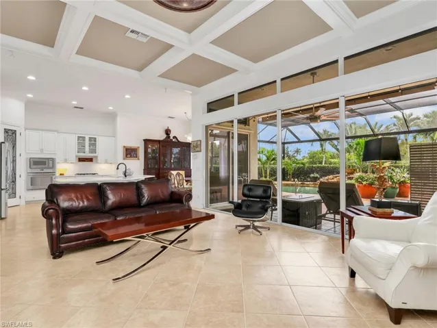Spacious family room with pocket sliding doors leading to the pool area