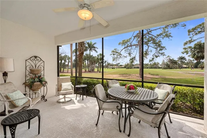 Sunroom featuring a ceiling fan