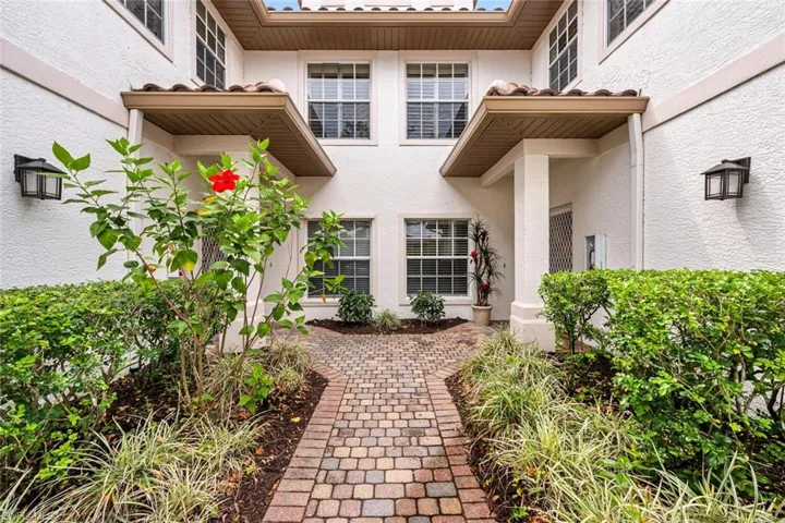 Entrance to property featuring stucco siding