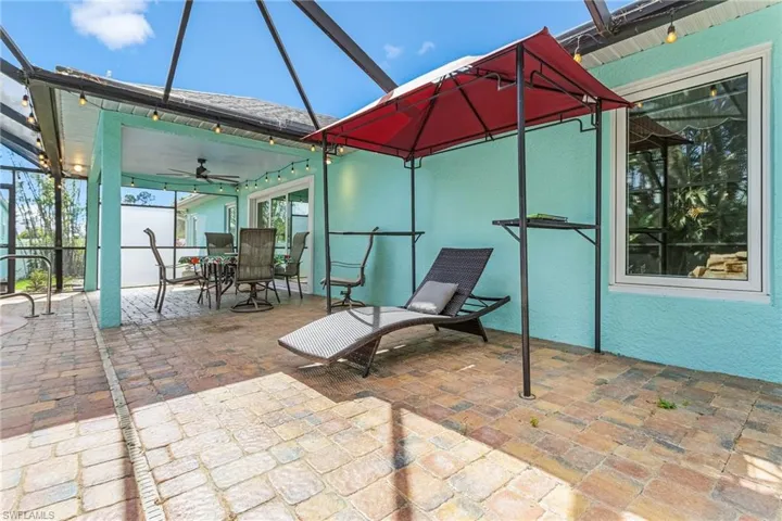 View of patio featuring ceiling fan