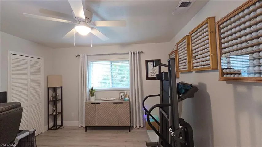 Light gray wood-finish flooring complements neutral wall tones