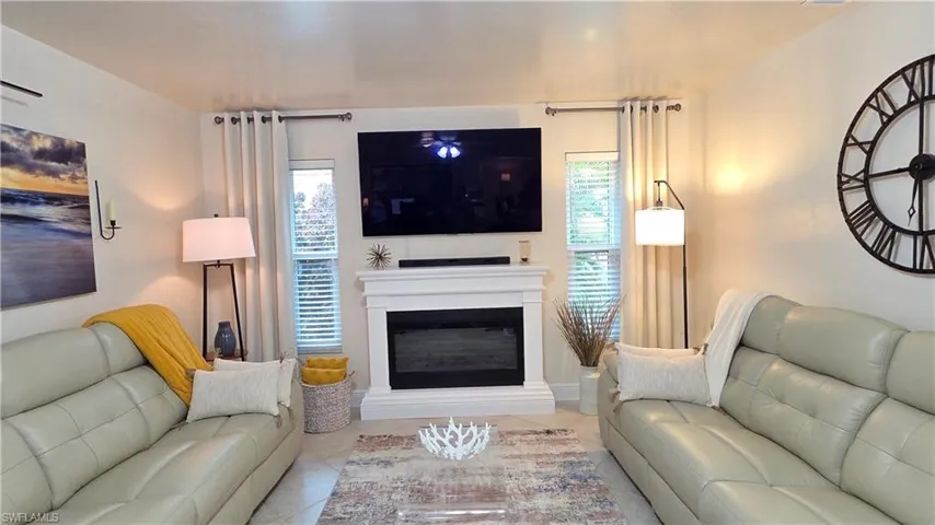 Central fireplace with a white mantel and hearth