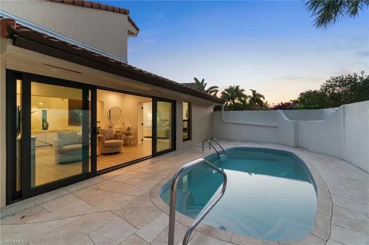 Pool with new glass stone coping, and freshly painted pool deck