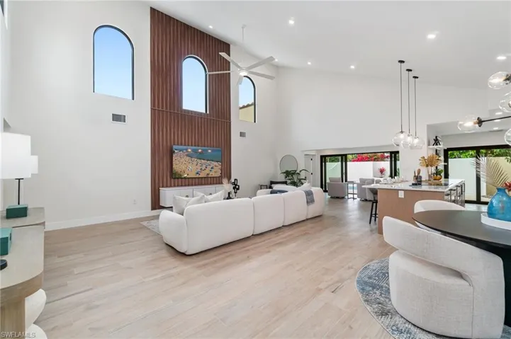 Redesign has created a spacious living area with walnut accent wall