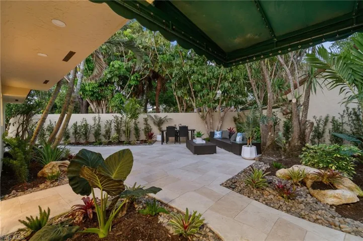 All new tropical landscaping creates a peaceful setting for outdooor living