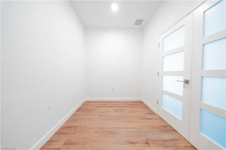 Empty room with light wood-style floors