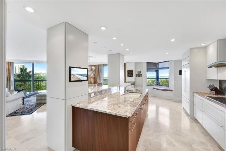 Custom Cabinetry, Miele Appliances, and Massive Walk-In Pantry adorn the Chef's Kitchen