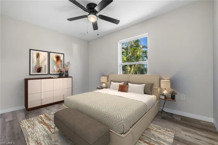 Bedroom with light hardwood / wood-style floors and ceiling fan