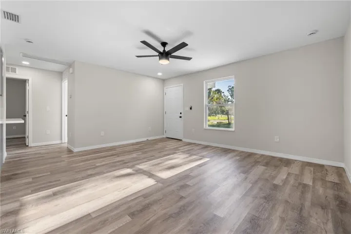 Spare room featuring light hardwood / wood-style floors and ceiling fan