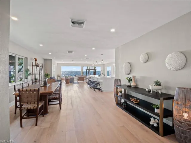 Dining area featuring light wood-style floors and recessed lighting