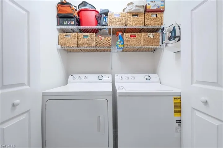 Laundry room featuring washer and clothes dryer