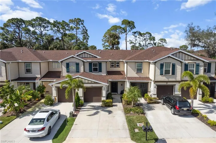 Craftsman house with a residential view, concrete driveway, and a garage