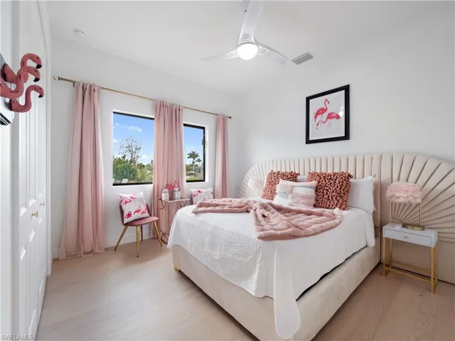 Bedroom featuring light wood-style flooring and ceiling fan