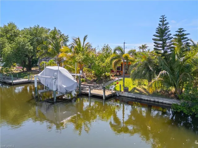 Dock with boat lift and a water view