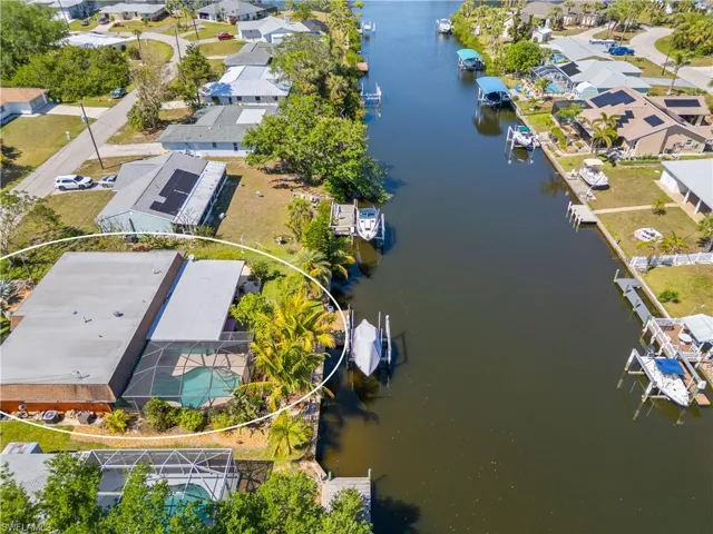 Aerial view of residential area featuring a large body of water