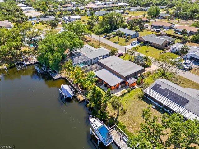 Aerial perspective of suburban area with a large body of water