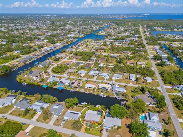 View of property location with nearby suburban area and a large body of water