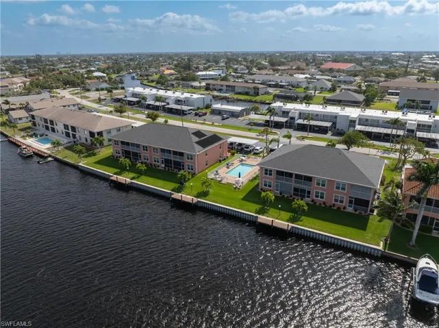Drone / aerial view featuring a residential view and a water view