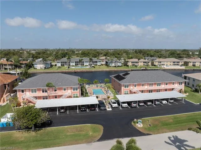 Drone / aerial view with a water view and a residential view