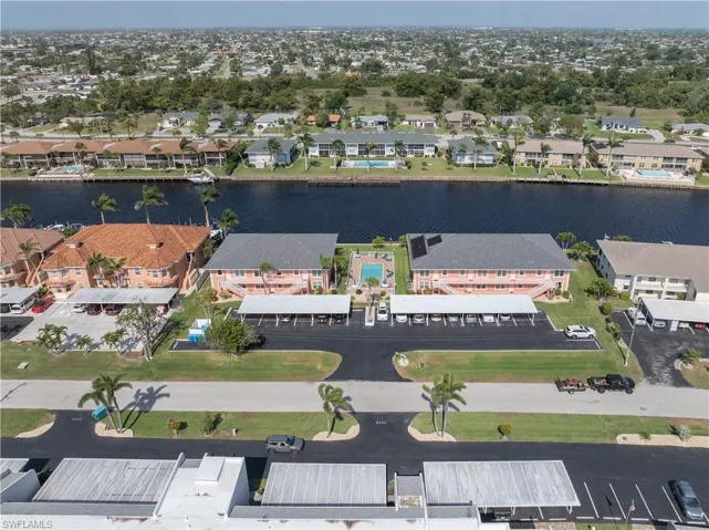 Drone / aerial view featuring a water view and a residential view
