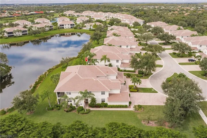 Aerial perspective of suburban area with a large body of water