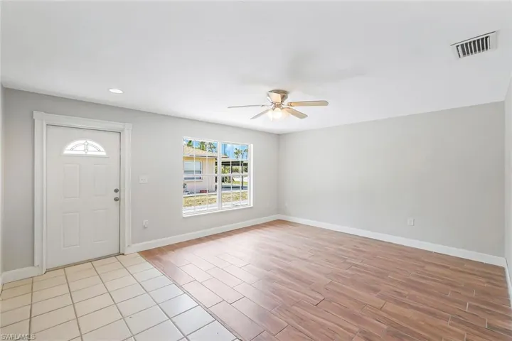 Entrance foyer featuring ceiling fan, light wood-style flooring, and recessed lighting