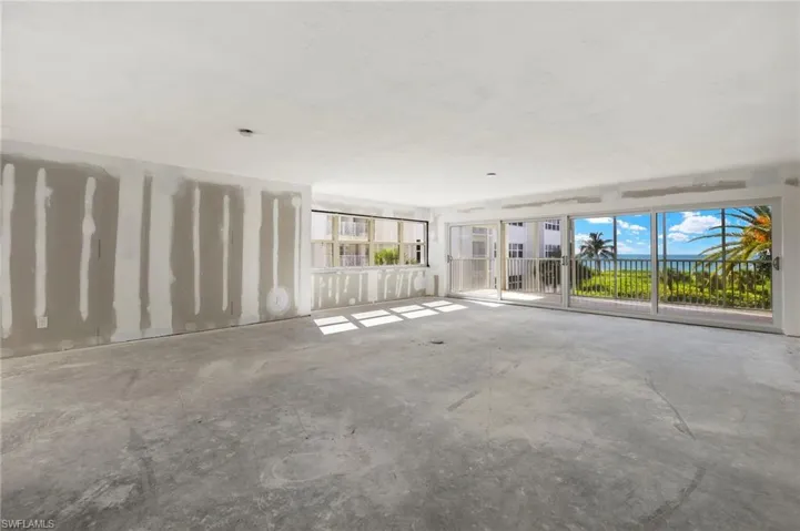 Unfurnished living room with concrete flooring