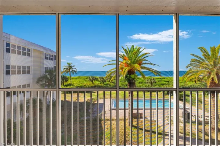 Unfurnished sunroom with a water view