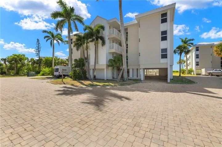 View of property with a carport