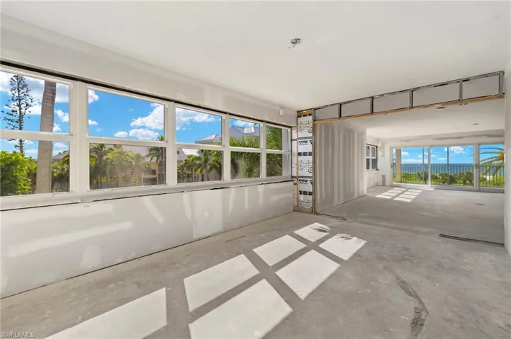 Unfurnished sunroom featuring a wealth of natural light