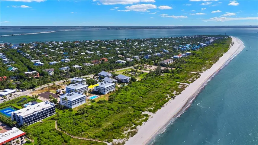Drone / aerial view featuring a view of the beach and a water view