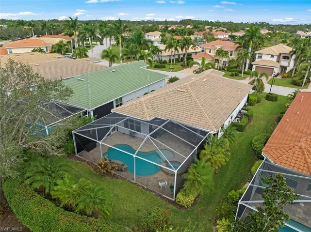 Aerial view of rear of home showing back and side yard