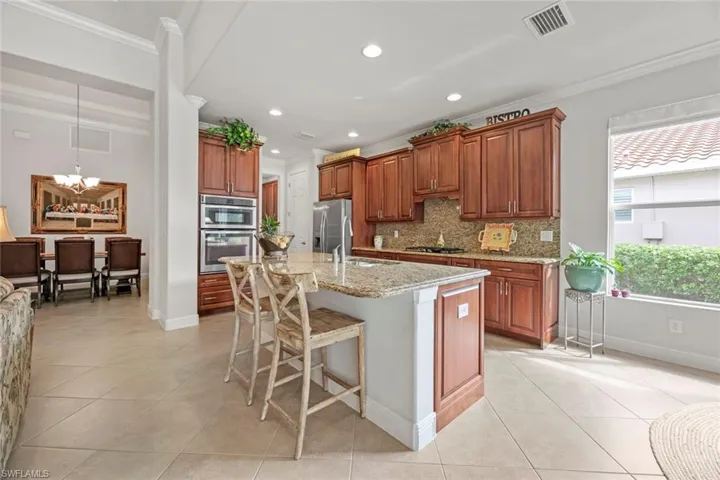 Kitchen has ample cabinetry, built-in appliances