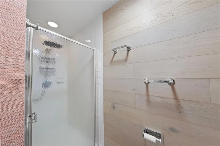 Full bath featuring a shower stall