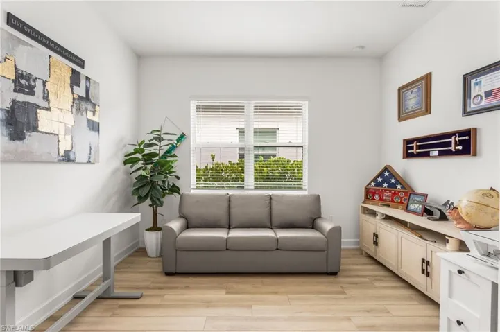 Sitting room with light wood-style flooring