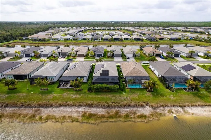 Aerial view of residential area with a nearby body of water