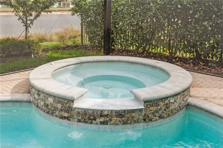 Integrated pool / hot tub with a patio area
