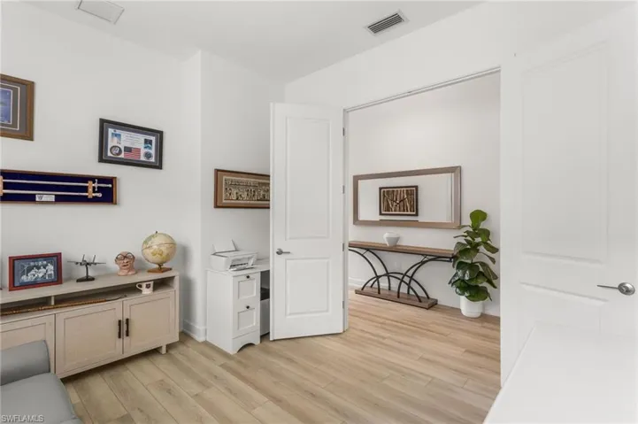Office featuring light wood-style floors and baseboards